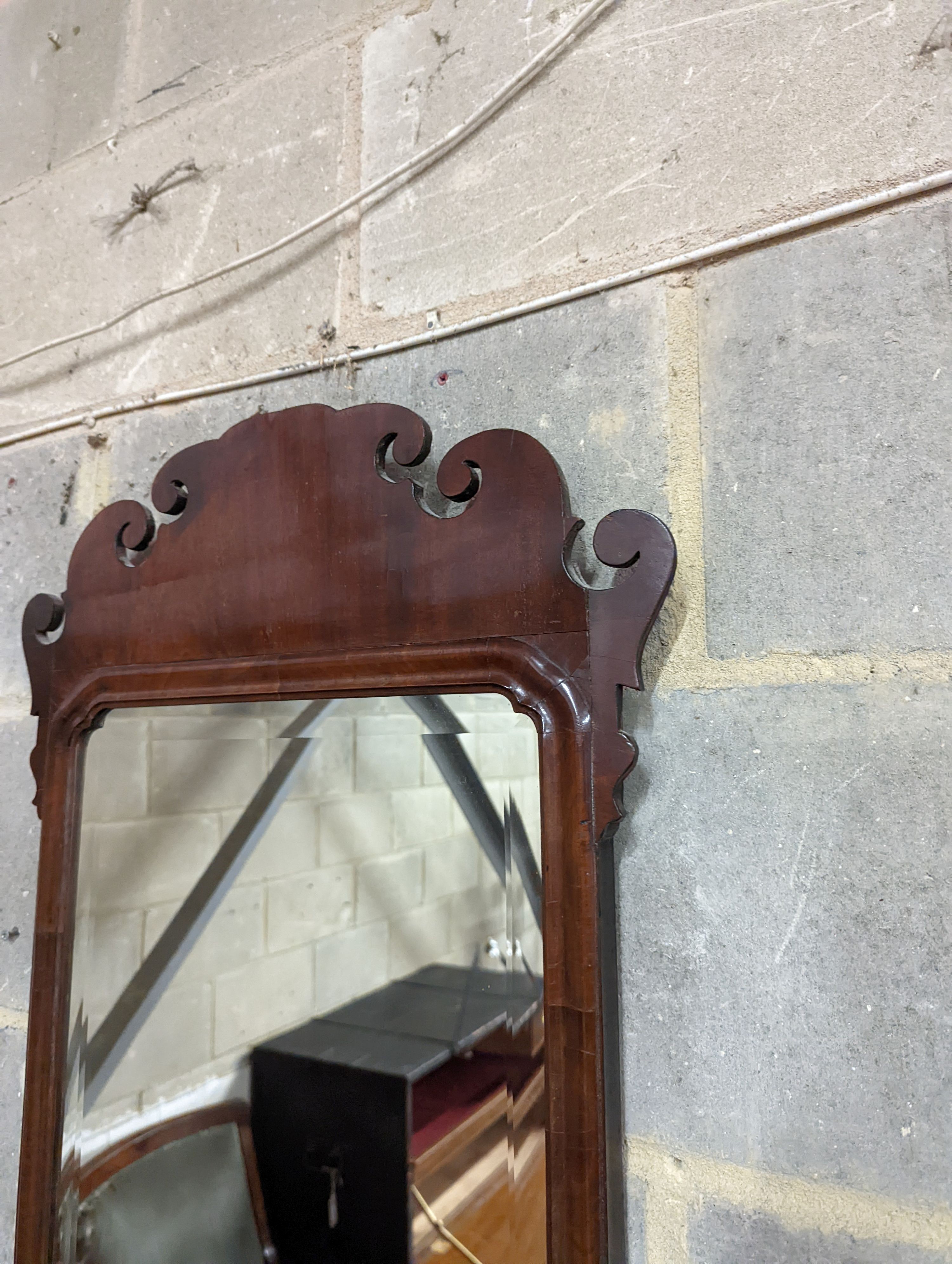 A George II style Fret cut mahogany wall mirror. Length - 86cm, Width - 48cm.